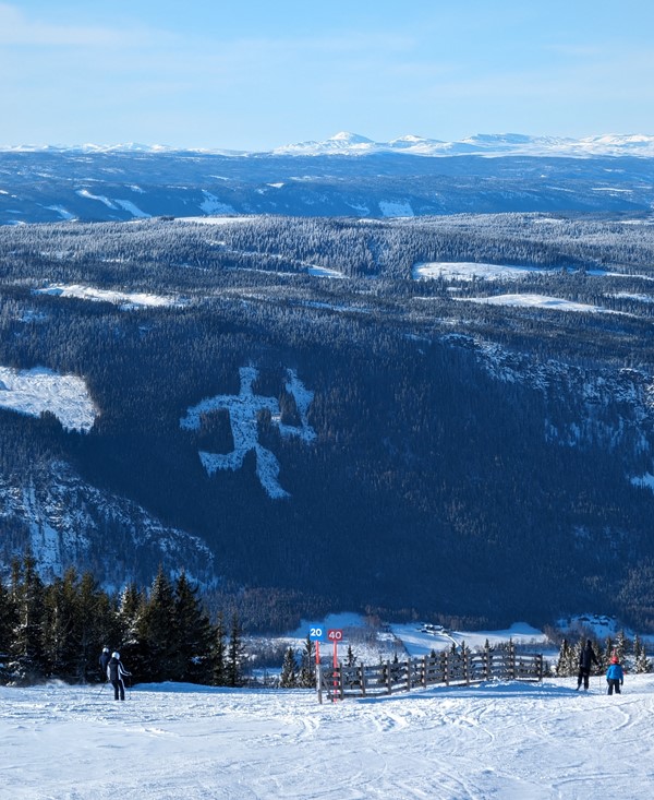 'Fakkelmannen' – Olympic torch man craved out of the forest for 1994 Lillehammer’s Olympics, seen from the Hafjell slopes