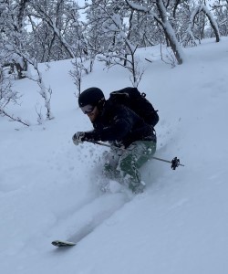 Photo of person skiing down a hill